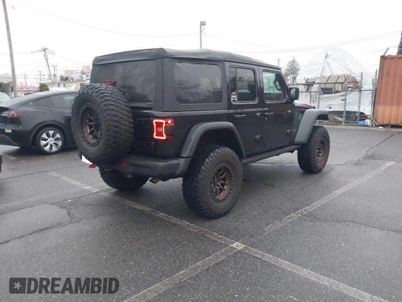 2022 Jeep Wrangler Unlimited Rubicon with VIN 1C4HJXFGXNW127064, listed as a IAAI auction lot 41491203 with 47,700 mi miles and . Bid and sale history available at DreamBid. Image 4.