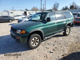 1999 Mitsubishi Montero LS z VIN JA4LS31H5XP033598, wystawiony jako Copart lot #85609464 z przebiegiem 185 686 mil mil oraz Szkoda całkowita • Salvage title. Historia ofert i sprzedaży dostępna na DreamBid. Obrazek 1.