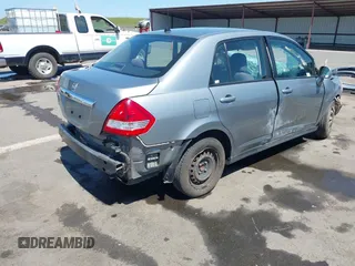 2009 Nissan Versa 1.8 S with VIN 3N1BC11E09L449780, listed as a IAAI auction lot 42034977 with 180,680 mi miles. Bid and sale history available at carsss.com. Image 4.