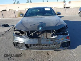 2019 BMW 5 Series M550i xDrive with VIN WBAJB9C51KB288416, listed as a IAAI auction lot 41265378 with 52,529 mi miles and . Bid and sale history available at DreamBid. Image 13.