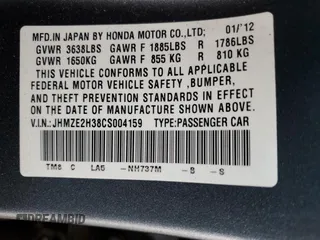 2012 Honda Insight z VIN JHMZE2H38CS004159, wystawiony jako Copart lot #60316925 z przebiegiem 142 601 mil mil oraz Szkoda całkowita • Salvage title. Historia ofert i sprzedaży dostępna na DreamBid. Obrazek 12.