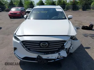 2021 Mazda CX-9 Grand Touring z VIN JM3TCBDY8M0537986, wystawiony jako IAAI lot #42267157 z przebiegiem 25 375 mil mil oraz . Historia ofert i sprzedaży dostępna na DreamBid. Obrazek 13.