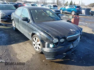 2004 Jaguar X-Type with VIN SAJEA51C74WE14084, listed as a IAAI auction lot 41560766 with 166,419 mi miles. Bid and sale history available at carsss.com. Image 1.