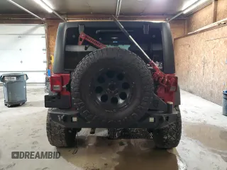 2012 Jeep Wrangler Unlimited Sport z VIN 1C4BJWDG8CL282181, wystawiony jako Copart lot #53863375 z przebiegiem 92 984 mil mil oraz Szkoda całkowita • Salvage title. Historia ofert i sprzedaży dostępna na DreamBid. Obrazek 6.