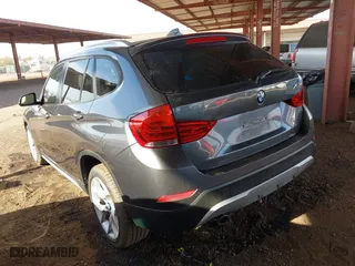 2013 BMW X1 28i with VIN WBAVM1C57DVW42096, listed as a IAAI auction lot 41572971 with 156,999 mi miles. Bid and sale history available at carsss.com. Image 3.