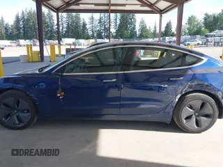 2018 Tesla Model 3 Long Range Battery z VIN 5YJ3E1EA6JF041970, wystawiony jako IAAI lot #42224514 z przebiegiem 79 744 mil mil oraz . Historia ofert i sprzedaży dostępna na DreamBid. Obrazek 14.