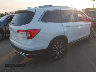 2019 Honda Pilot Touring 8-Passenger with VIN 5FNYF5H97KB005203, listed as a IAAI auction lot 41399930 with 47,267 mi miles and . Bid and sale history available at DreamBid. Image 4.