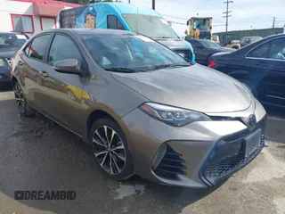 2017 Toyota Corolla L z VIN 5YFBURHE5HP730912, wystawiony jako IAAI lot #41610019 z przebiegiem 61 440 mil mil oraz . Historia ofert i sprzedaży dostępna na DreamBid. Obrazek 1.