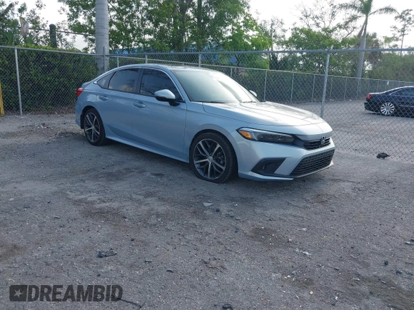 2023 Honda Civic Touring with VIN 2HGFE1F91PH305053, listed as a IAAI auction lot 42378311 with 41,576 mi miles and . Bid and sale history available at DreamBid. Image 1.