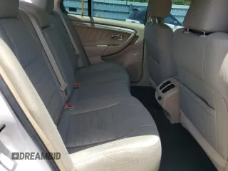 2013 Ford Taurus SE z VIN 1FAHP2D87DG117653, wystawiony jako Copart lot #57232395 z przebiegiem 101 307 mil mil oraz Szkoda całkowita • Salvage title. Historia ofert i sprzedaży dostępna na DreamBid. Obrazek 10.