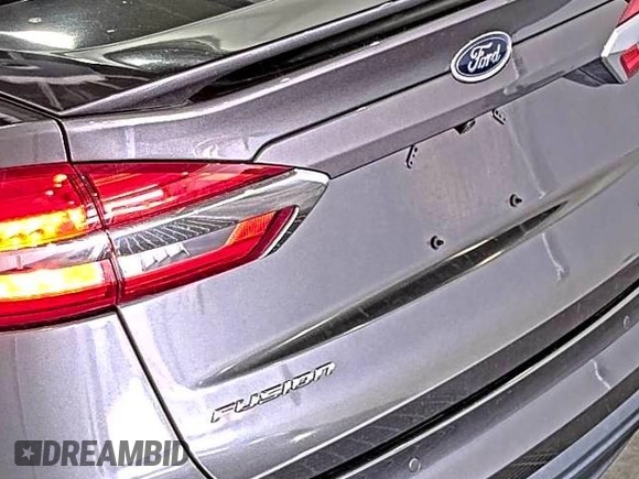 2020 Ford Fusion SE z VIN 3FA6P0HD6LR189762, wystawiony jako IAAI lot #42780149 z przebiegiem 51 099 mil mil oraz . Historia ofert i sprzedaży dostępna na DreamBid. Obrazek 12.