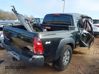 2015 Toyota Tacoma with VIN 3TMLU4EN8FM195249, listed as a IAAI auction lot 41416129 with 129,544 mi miles. Bid and sale history available at carsss.com. Image 4.