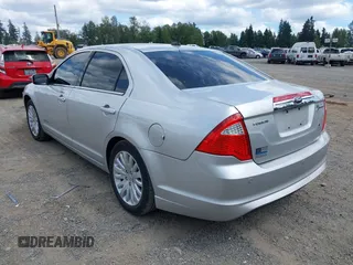 2012 Ford Fusion Hybrid with VIN 3FADP0L35CR440051, listed as a IAAI auction lot 42644284 with 89,087 mi miles and . Bid and sale history available at DreamBid. Image 3.