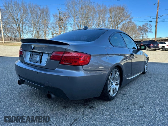 2011 BMW 3 Series 335i xDrive with VIN WBAKF9C54BE620159, listed as a Copart auction lot 67015535 with 100,525 mi miles and Clean title. Bid and sale history available at DreamBid. Image 4.