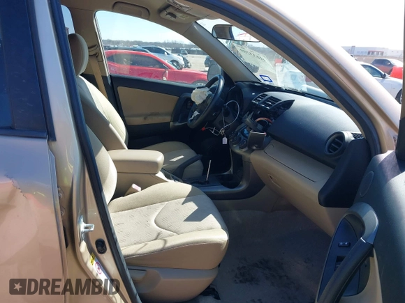 2009 Toyota RAV4 with VIN JTMZF33V995000660, listed as a IAAI auction lot 41633209 with 106,959 mi miles. Bid and sale history available at carsss.com. Image 5.