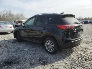 2016 Mazda CX-5 Touring z VIN JM3KE4CY0G0667171, wystawiony jako Copart lot #51579005 z przebiegiem 39 487 mil mil oraz Szkoda całkowita • Salvage title. Historia ofert i sprzedaży dostępna na DreamBid. Obrazek 2.