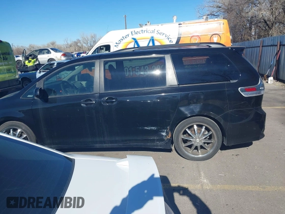 2012 Toyota Sienna SE with VIN 5TDXK3DC9CS179896, listed as a IAAI auction lot 41672616 with 216,638 mi miles. Bid and sale history available at carsss.com. Image 14.