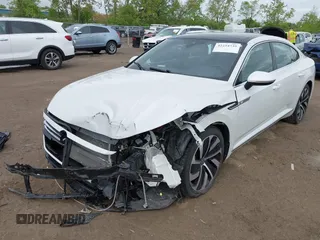 2021 Volkswagen Arteon SEL R-Line z VIN WVWSR7AN6ME007156, wystawiony jako IAAI lot #42254735 z przebiegiem 32 004 mil mil oraz . Historia ofert i sprzedaży dostępna na DreamBid. Obrazek 2.