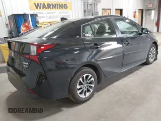 2022 Toyota Prius L Eco with VIN JTDKAMFU2N3186072, listed as a IAAI auction lot 42486252 with 5,887 mi miles and . Bid and sale history available at DreamBid. Image 4.
