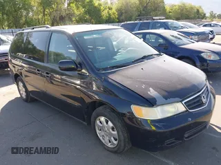2004 Honda Odyssey EX-L z VIN 5FNRL18974B047511, wystawiony jako IAAI lot #42327289 z przebiegiem 148 664 mil mil oraz . Historia ofert i sprzedaży dostępna na DreamBid. Obrazek 1.