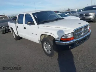 2002 Dodge Dakota SLT with VIN 1B7HL48NX2S518299, listed as a IAAI auction lot 41414659 with 220,943 mi miles. Bid and sale history available at carsss.com. Image 1.