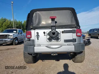 2016 Jeep Wrangler Sahara z VIN 1C4AJWBGXGL120329, wystawiony jako IAAI lot #40239916 z przebiegiem 96 731 mil mil oraz . Historia ofert i sprzedaży dostępna na DreamBid. Obrazek 16.