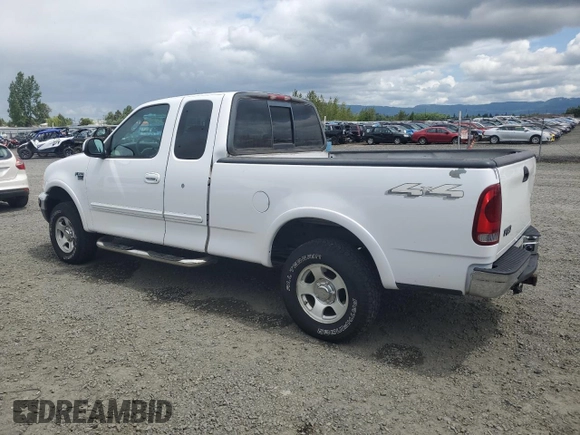 2002 Ford F-150 XL with VIN 1FTRX18L62KC53807, listed as a Copart auction lot 57463075 with 173,301 mi miles and Salvage title. Bid and sale history available at DreamBid. Image 2.