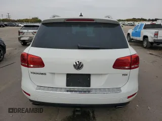 2013 Volkswagen Touareg Sport с VIN WVGEP9BP9DD003974, выставлен на аукционе Copart как лот 75106234 с пробегом 211 323 миль миль и Чистый • Clean title. История ставок и продаж доступна на DreamBid. Изображение 6.