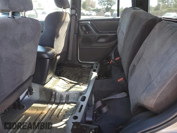 1999 Jeep Grand Cherokee Laredo with VIN 1J4GW58N4XC739465, listed as a Copart auction lot 76130544 with 195,649 mi miles and Salvage title. Bid and sale history available at DreamBid. Image 11.