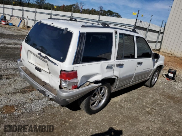 1996 Jeep Grand Cherokee Laredo with VIN 1J4FX58SXTC349575, listed as a Copart auction lot 80545584 with 302,636 mi miles and Salvage Title. Bid and sale history available at carsss.com. Image 3.