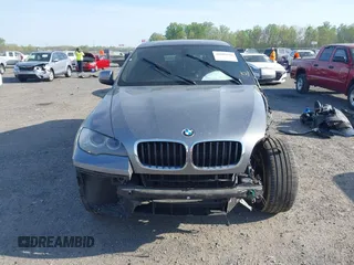 2014 BMW X6 xDrive35i z VIN 5UXFG2C57E0H10305, wystawiony jako IAAI lot #42109416 z przebiegiem 144 816 mil mil oraz . Historia ofert i sprzedaży dostępna na DreamBid. Obrazek 13.