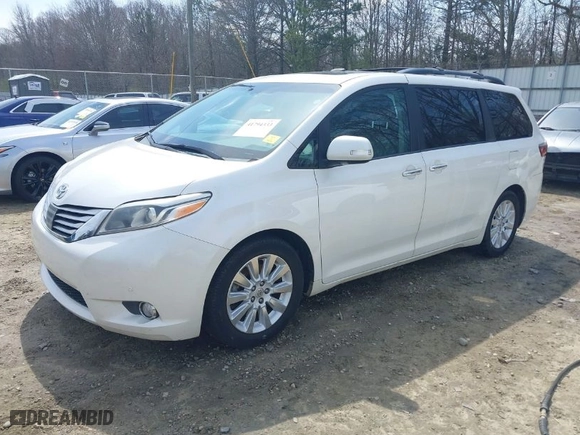 2015 Toyota Sienna XLE with VIN 5TDYK3DC0FS570007, listed as a IAAI auction lot 41794333 with 217,512 mi miles. Bid and sale history available at carsss.com. Image 2.