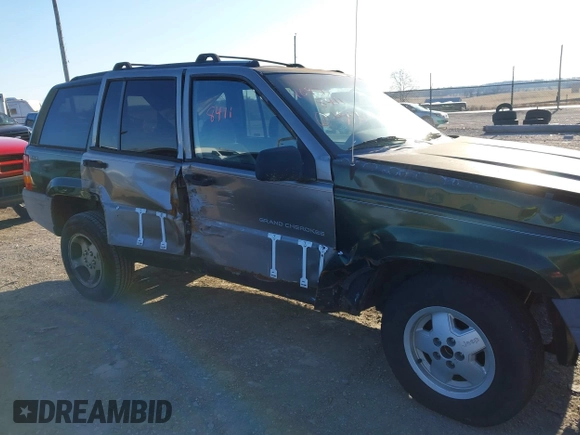 1997 Jeep Grand Cherokee Laredo with VIN 1J4GZ58SXVC687950, listed as a IAAI auction lot 40978411 with 176,514 mi miles. Bid and sale history available at carsss.com. Image 6.