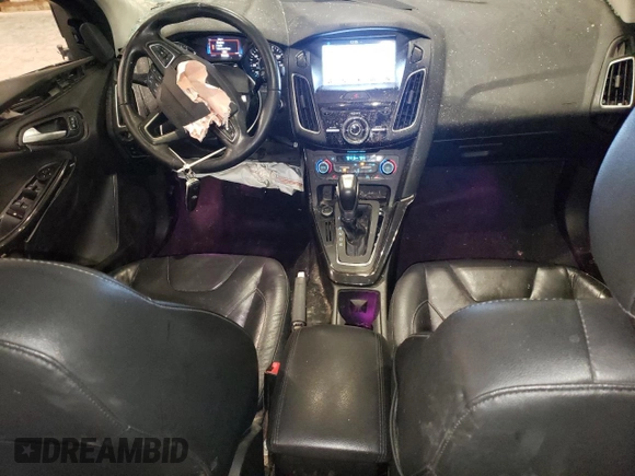 2016 Ford Focus Titanium z VIN 1FADP3J27GL310367, wystawiony jako Copart lot #55048005 z przebiegiem 86 676 mil mil oraz Szkoda całkowita • Salvage title. Historia ofert i sprzedaży dostępna na DreamBid. Obrazek 8.
