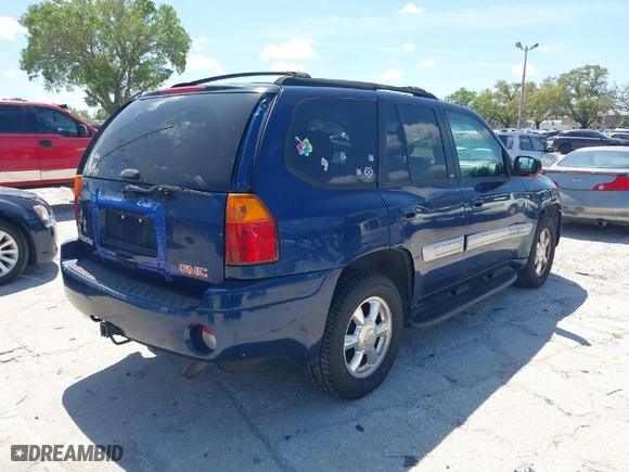 2004 GMC Envoy SLE with VIN 1GKDT13S142206535, listed as a IAAI auction lot 41853542 with 135,053 mi miles. Bid and sale history available at carsss.com. Image 4.