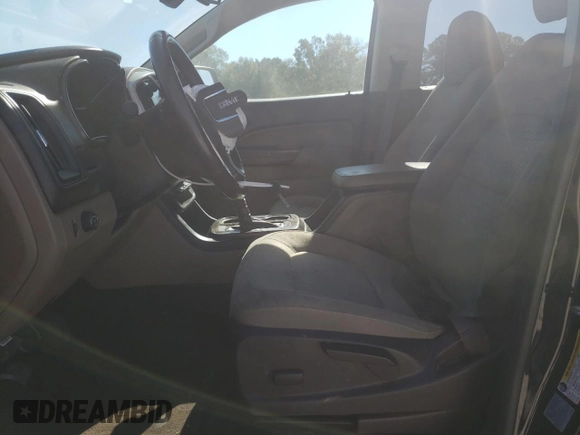 2015 GMC Canyon 2WD SLE with VIN 1GTG5BEA6F1221120, listed as a Copart auction lot 77391484 with 180,334 mi miles and Salvage Title. Bid and sale history available at carsss.com. Image 7.