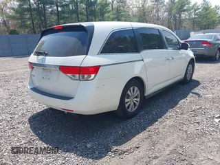 2015 Honda Odyssey EX-L with VIN 5FNRL5H64FB069742, listed as a IAAI auction lot 42101807 with 152,611 mi miles and . Bid and sale history available at DreamBid. Image 4.