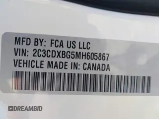 2021 Dodge Charger SXT with VIN 2C3CDXBG5MH605867, listed as a IAAI auction lot 41682336 with 56,660 mi miles and . Bid and sale history available at DreamBid. Image 9.