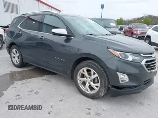 2021 Chevrolet Equinox Premier z VIN 2GNAXNEV9M6140537, wystawiony jako IAAI lot #42016514 z przebiegiem 52 237 mil mil oraz . Historia ofert i sprzedaży dostępna na DreamBid. Obrazek 1.