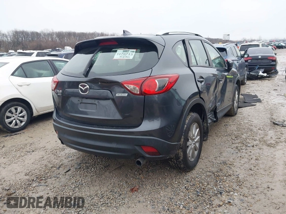 2016 Mazda CX-5 Sport with VIN JM3KE4BY5G0885754, listed as a IAAI auction lot 41103575 with 136,263 mi miles and . Bid and sale history available at carsss.com. Image 4.