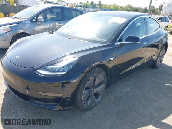 2018 Tesla Model 3 Long Range Battery with VIN 5YJ3E1EA7JF057031, listed as a IAAI auction lot 42139832 with 92,618 mi miles and . Bid and sale history available at DreamBid. Image 19.