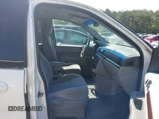 2007 Ford Freestar SEL z VIN 2FMZA52207BA08099, wystawiony jako IAAI lot #42025412 z przebiegiem Nie podano mil oraz . Historia ofert i sprzedaży dostępna na DreamBid. Obrazek 5.