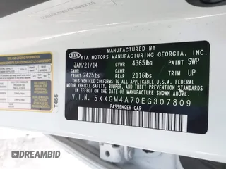 2014 Kia Optima LX with VIN 5XXGM4A70EG307809, listed as a IAAI auction lot 42023169 with 127,617 mi miles. Bid and sale history available at carsss.com. Image 9.