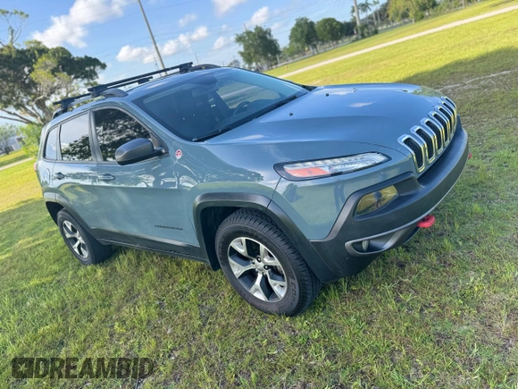 2015 Jeep Cherokee Trailhawk with VIN 1C4PJMBS1FW529559, listed as a Copart auction lot 66581755 with 113,915 mi miles and Salvage title. Bid and sale history available at DreamBid. Image 1.