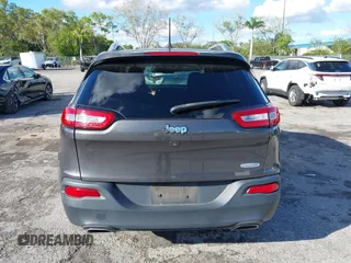 2016 Jeep Cherokee Altitude with VIN 1C4PJLCSXGW363598, listed as a IAAI auction lot 41670125 with 135,603 mi miles. Bid and sale history available at carsss.com. Image 16.