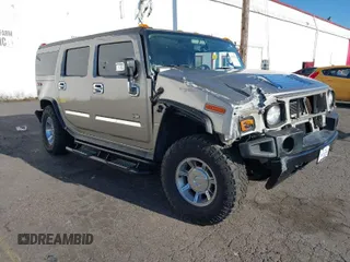 2003 Hummer H2 with VIN 5GRGN23U03H148051, listed as a IAAI auction lot 41394079 with 144,020 mi miles. Bid and sale history available at carsss.com. Image 1.