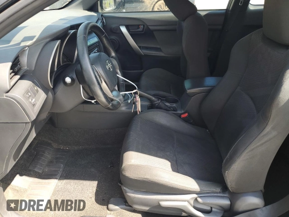 2012 Scion tC z VIN JTKJF5C72C3044845, wystawiony jako Copart lot #57863765 z przebiegiem 220 967 mil mil oraz Szkoda całkowita • Salvage title. Historia ofert i sprzedaży dostępna na DreamBid. Obrazek 7.
