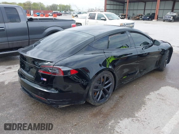 2022 Tesla Model S Plaid with VIN 5YJSA1E60NF460244, listed as a IAAI auction lot 41996403 with Not provided miles and . Bid and sale history available at DreamBid. Image 4.