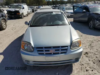 2005 Hyundai Accent GLS with VIN KMHCG35C55U325672, listed as a Copart auction lot 77685964 with 161,228 mi miles and Salvage Title. Bid and sale history available at carsss.com. Image 5.