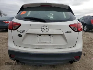 2015 Mazda CX-5 Sport z VIN JM3KE4BY2F0516574, wystawiony jako Copart lot #84100544 z przebiegiem Nie podano mil oraz Szkoda całkowita • Salvage title. Historia ofert i sprzedaży dostępna na DreamBid. Obrazek 6.